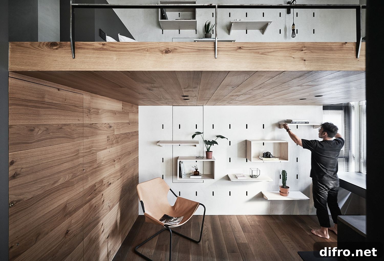 Tiny apartment featuring a smart mezzanine and an efficient storage wall