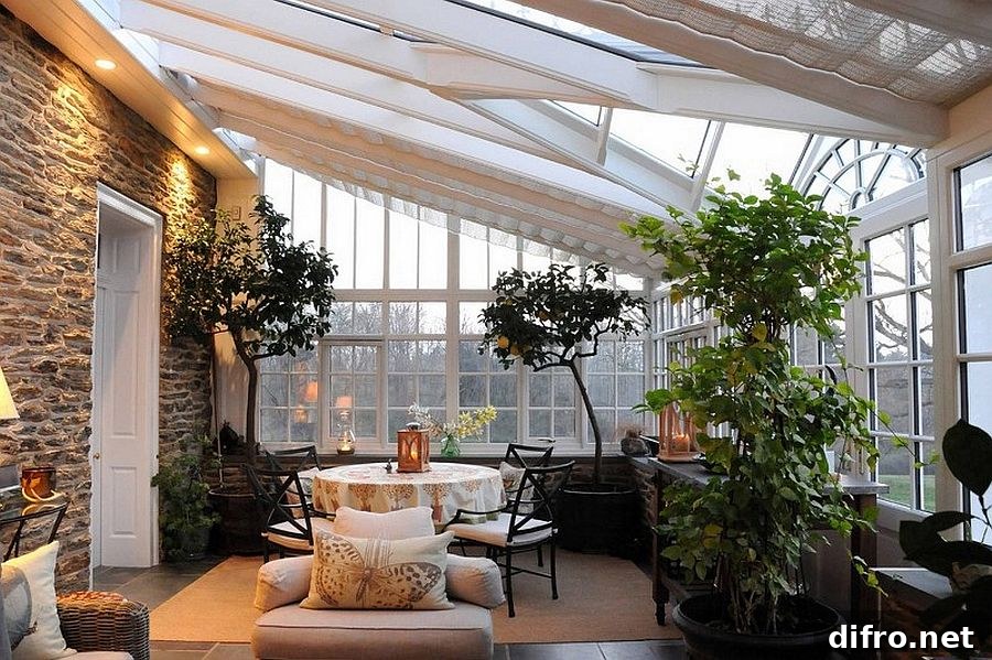 Luxurious use of indoor plants in a sunroom