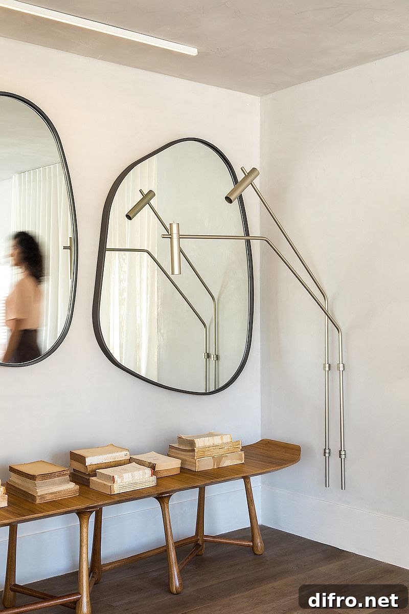 Slim console table and mirrors in the hallway