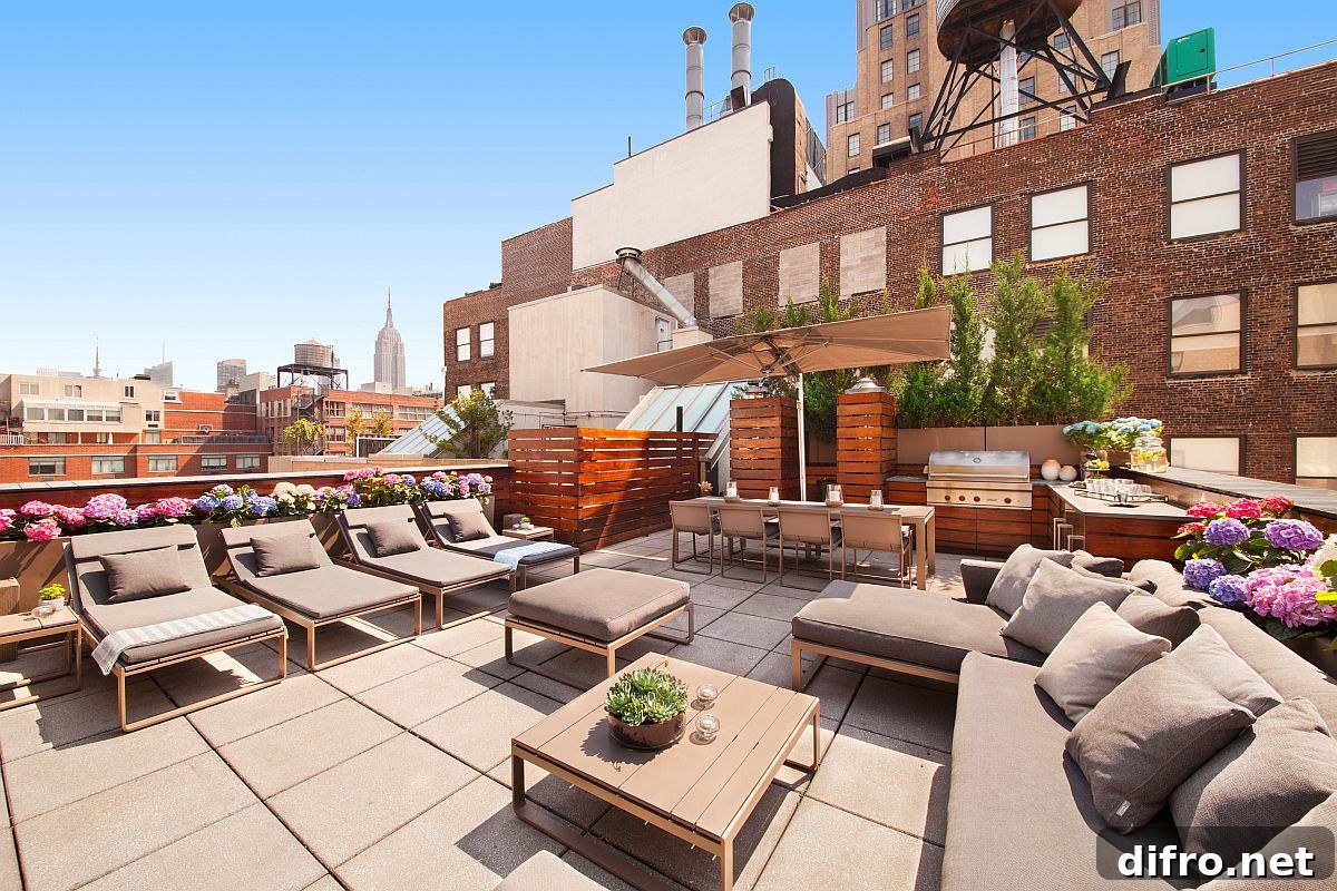 Spacious rooftop hangout with contemporary kitchen and ample seating