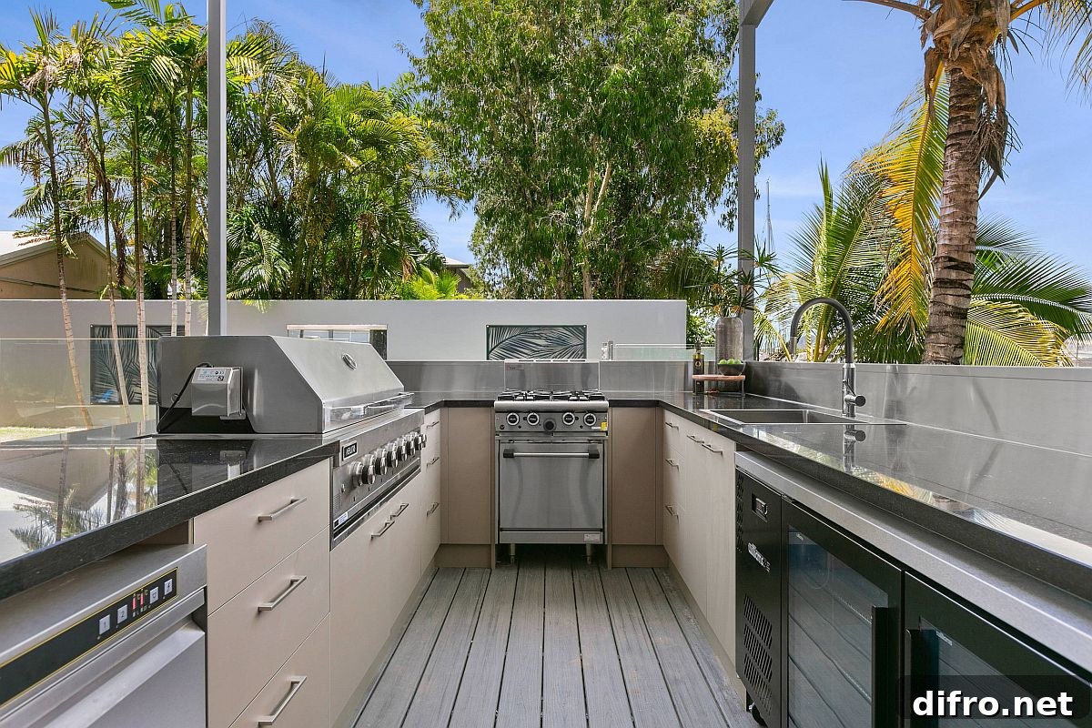U-shaped outdoor kitchen on a small rooftop with granite countertops