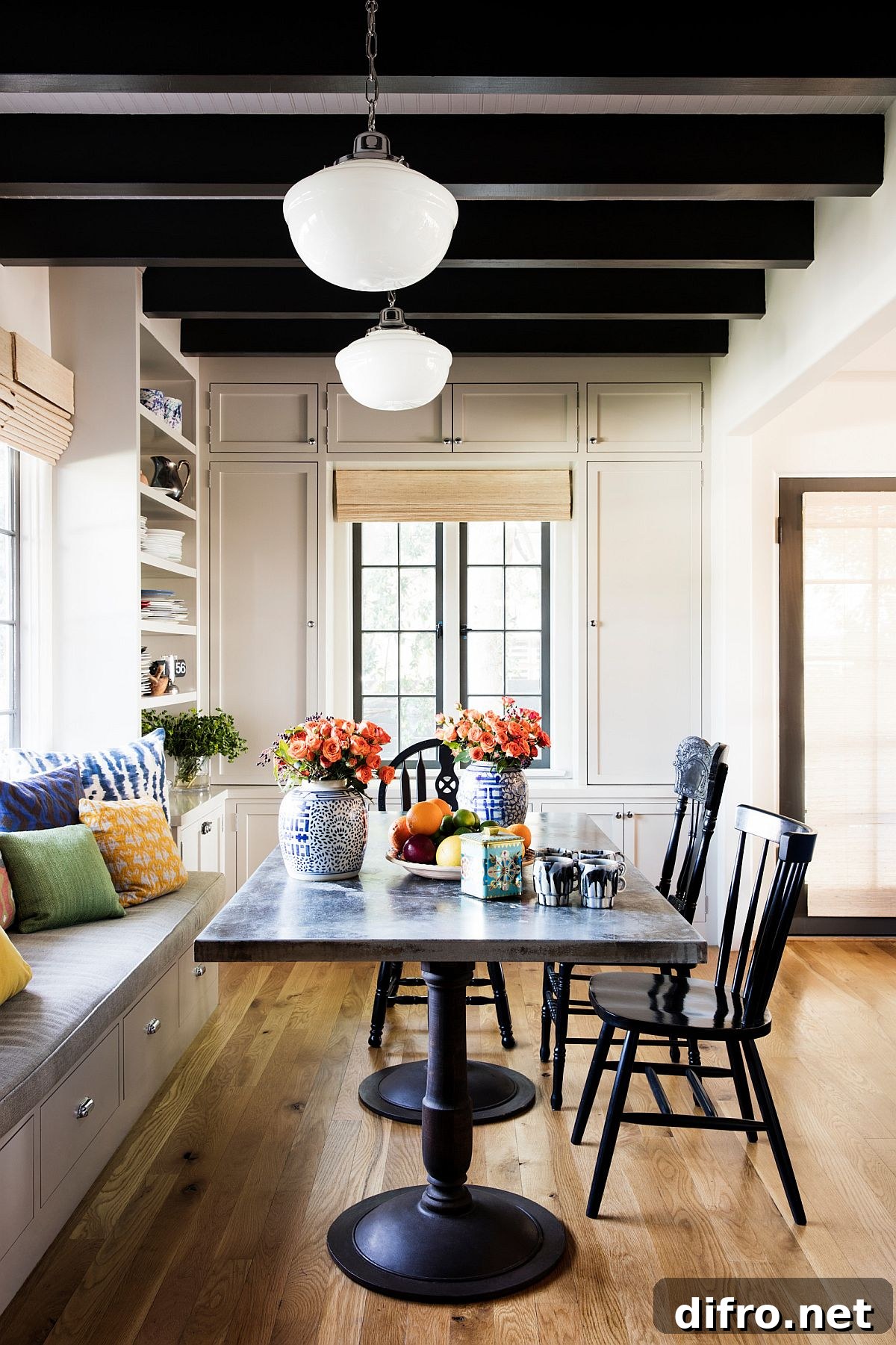 Dining space with dark ceiling beams and built-in bench