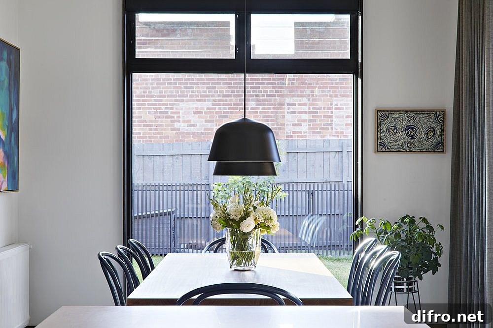 Dark pendants above the dining table