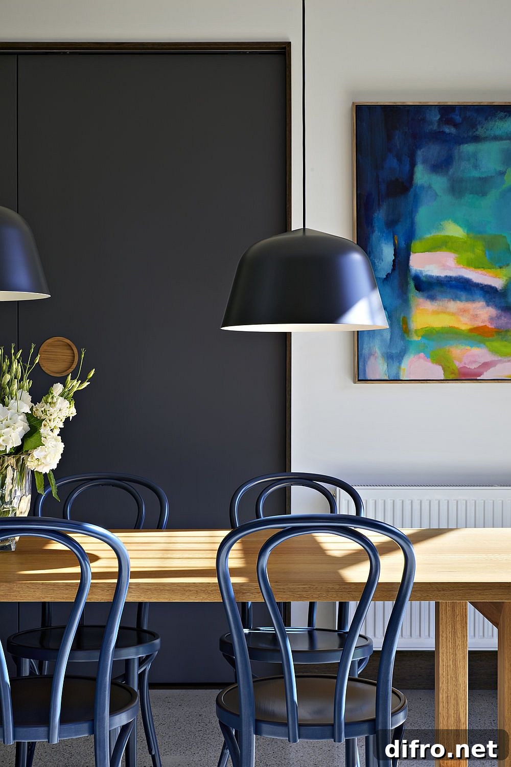 Dining room accents with wall art and pendants