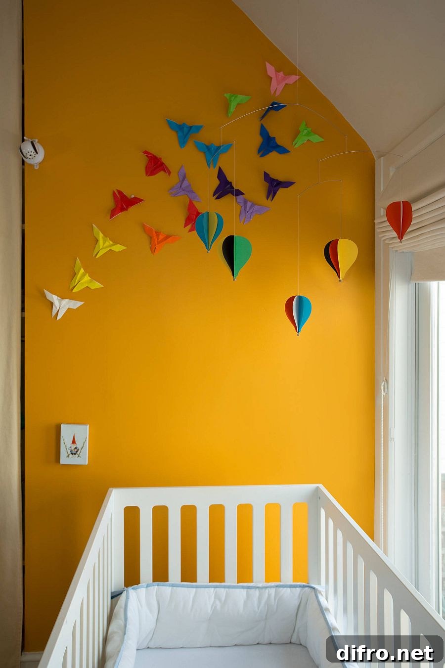Orange accent wall in nursery