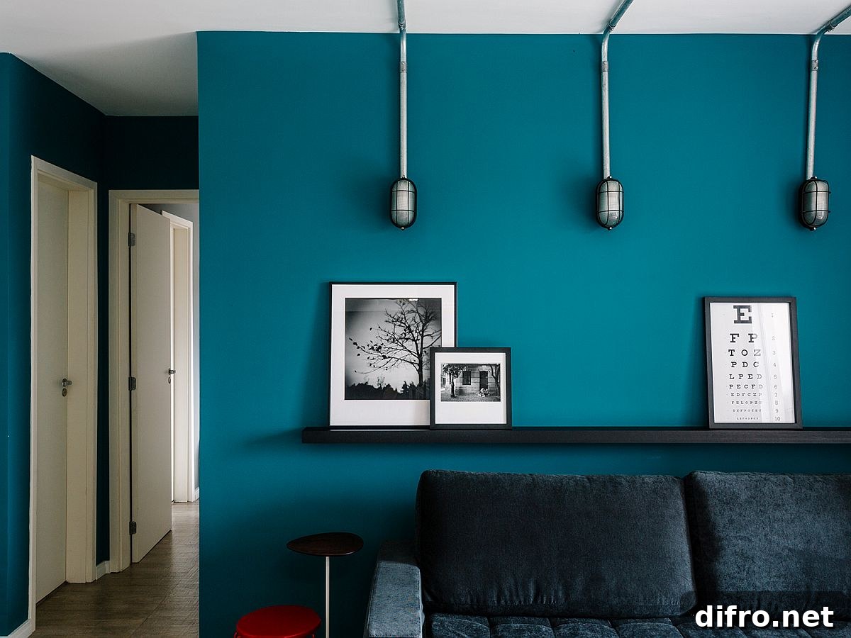 Black floating shelf above sofa
