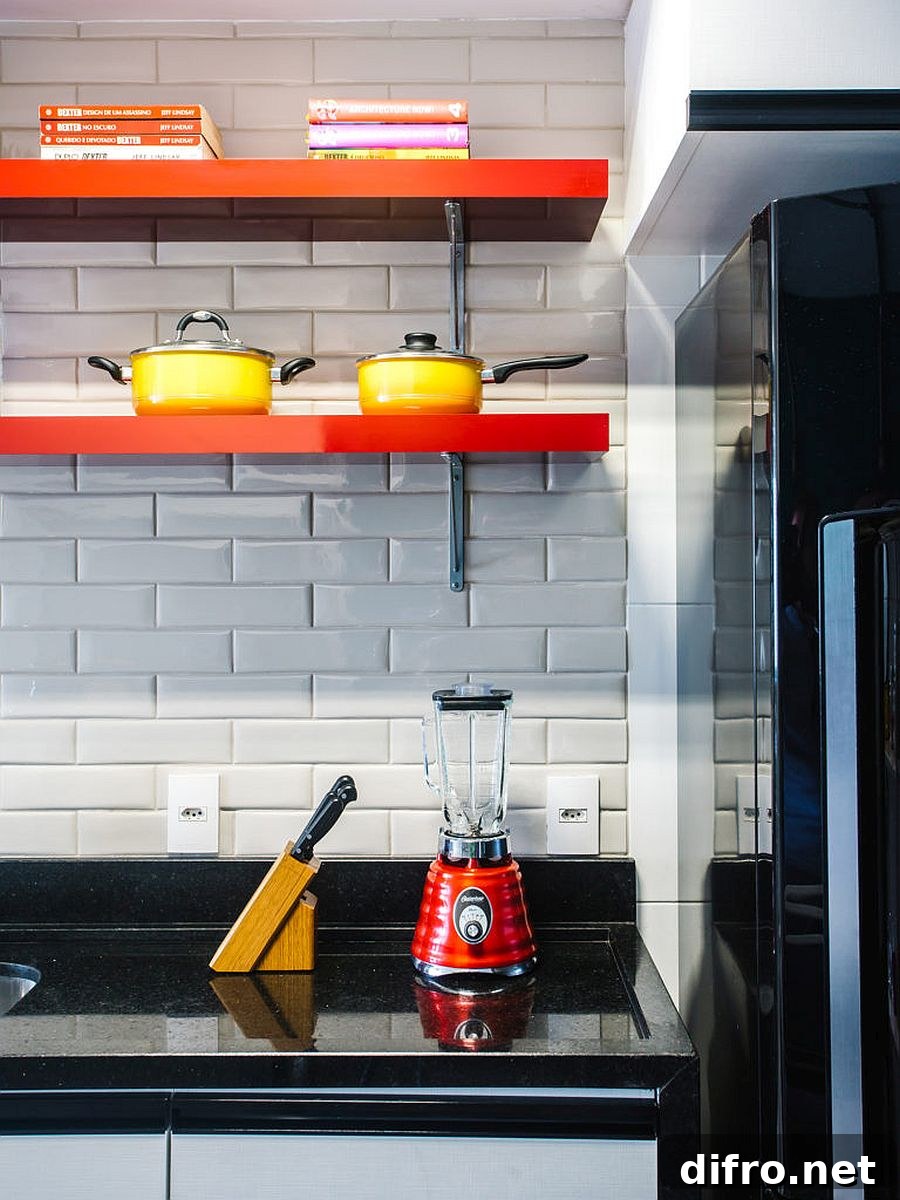 Orange floating shelves on white tiled backsplash