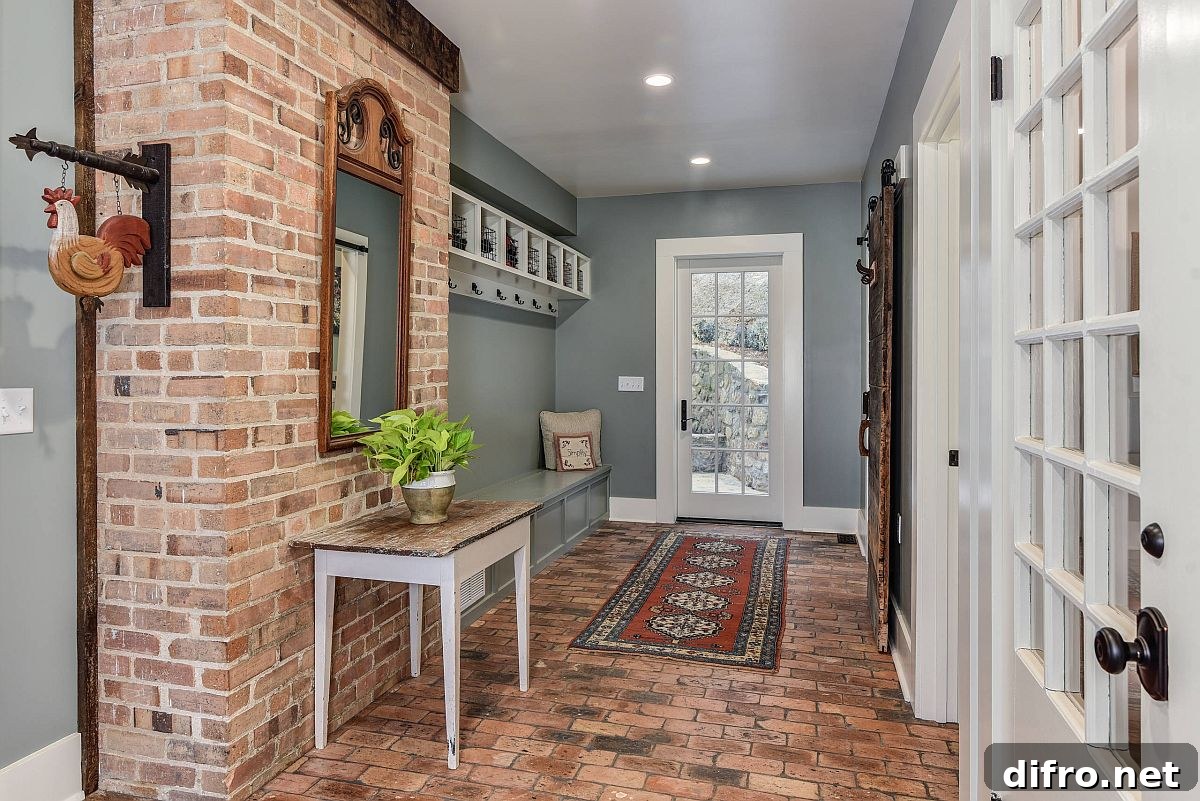 Contemporary and farmhouse entry with exposed brick and gray walls