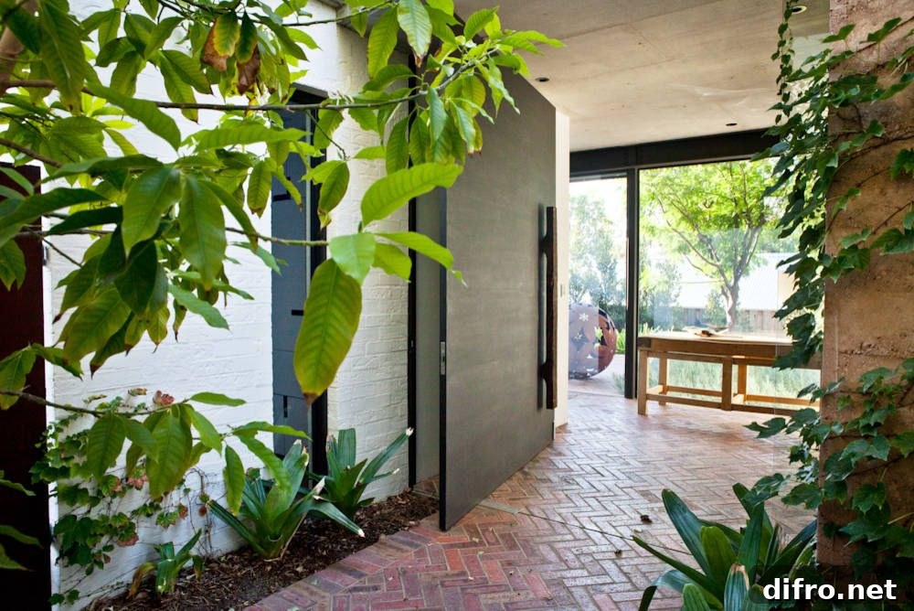 Contemporary entry with brick floor