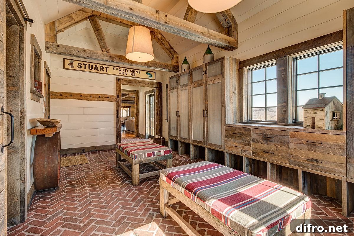 Spacious entry with wood cabinets and brick floor