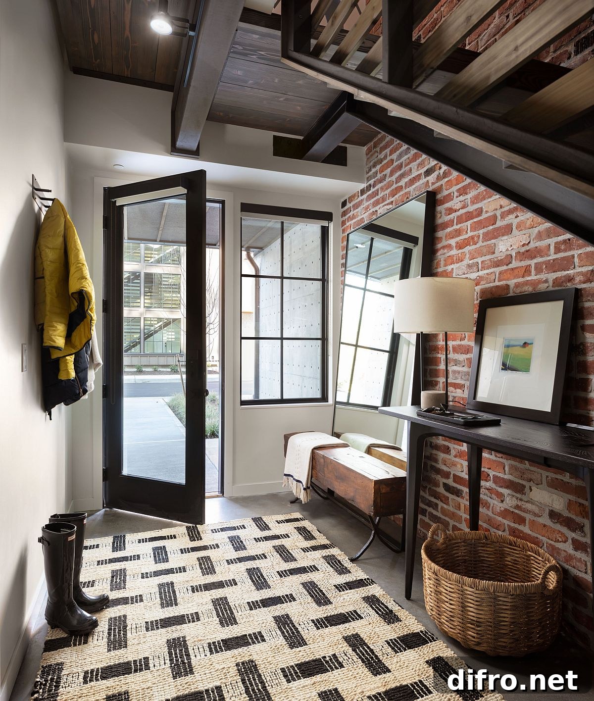 Industrial style entryway with exposed brick wall