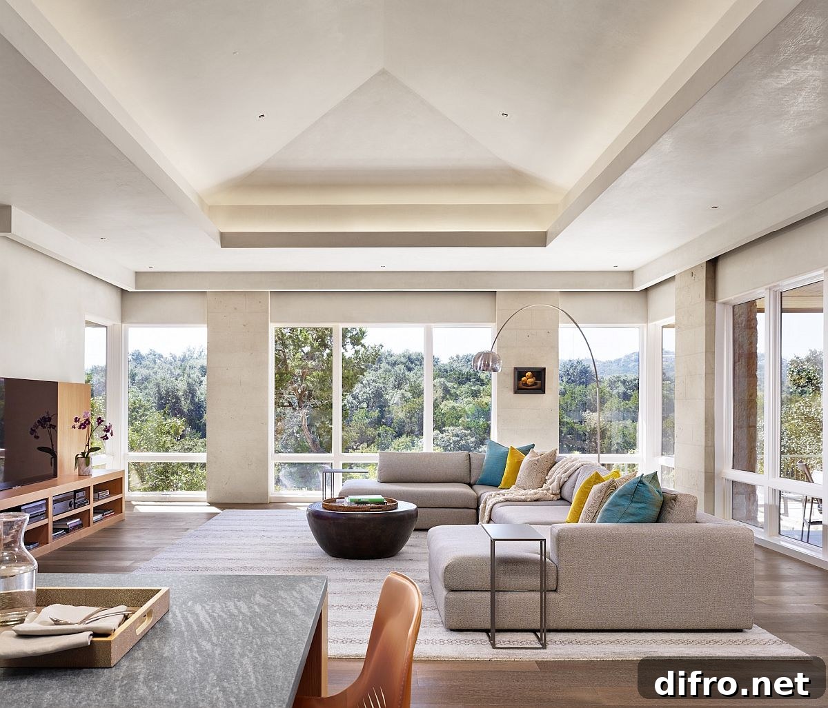 Modern minimal family room with sectional and outdoor view