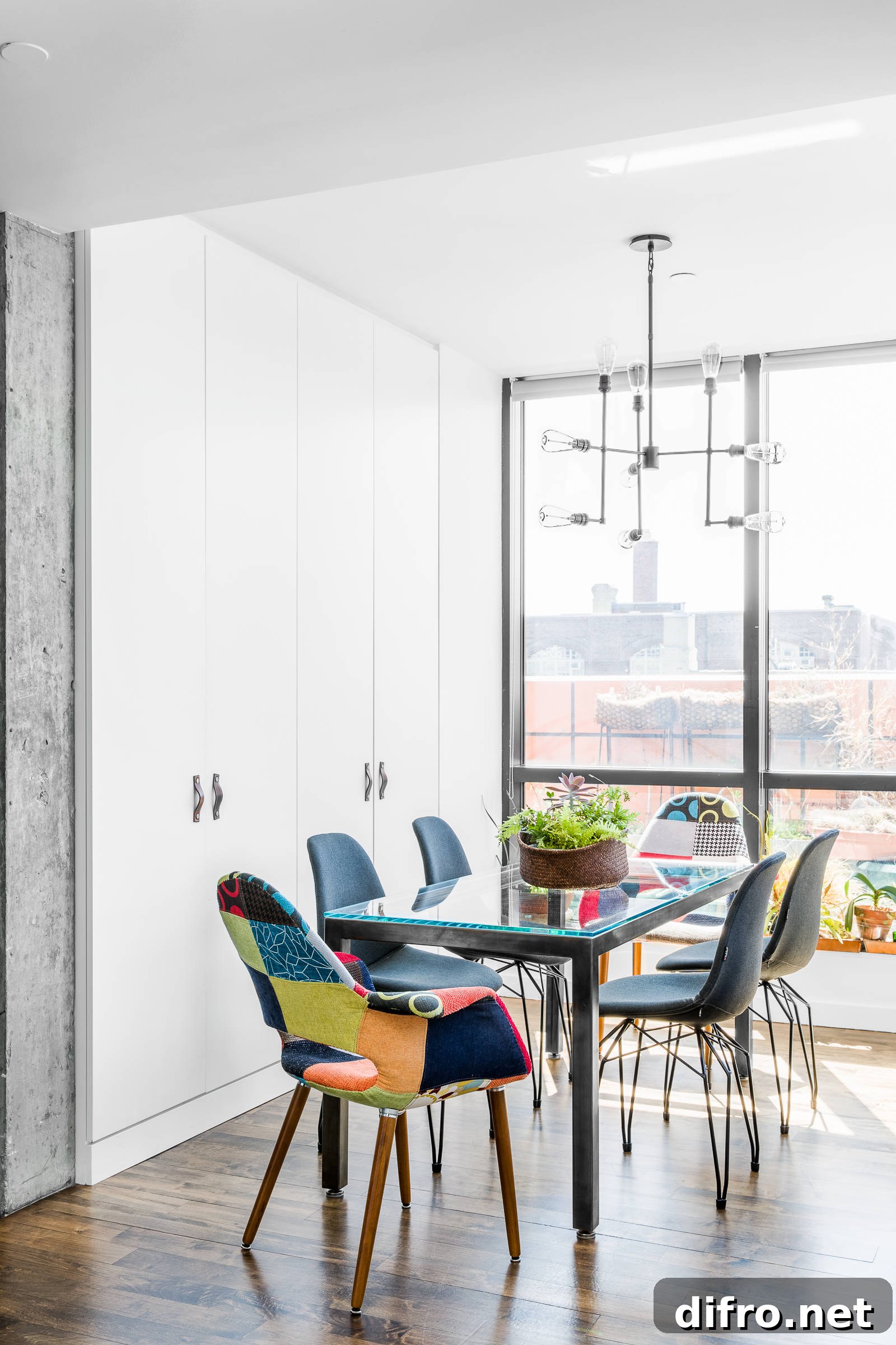 Two colorful chairs in a neutral dining room