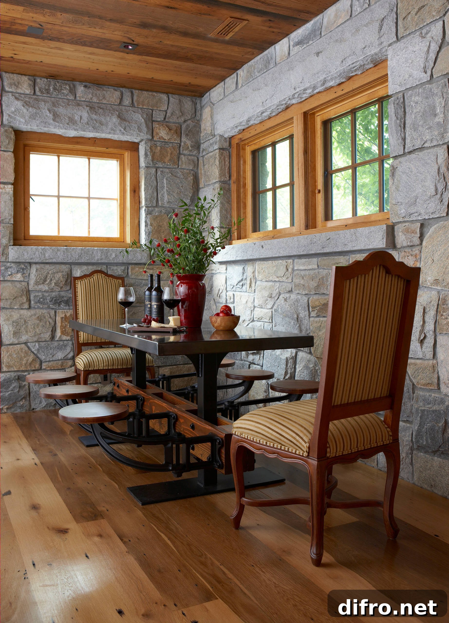 Dining room with stone walls and wooden ceiling