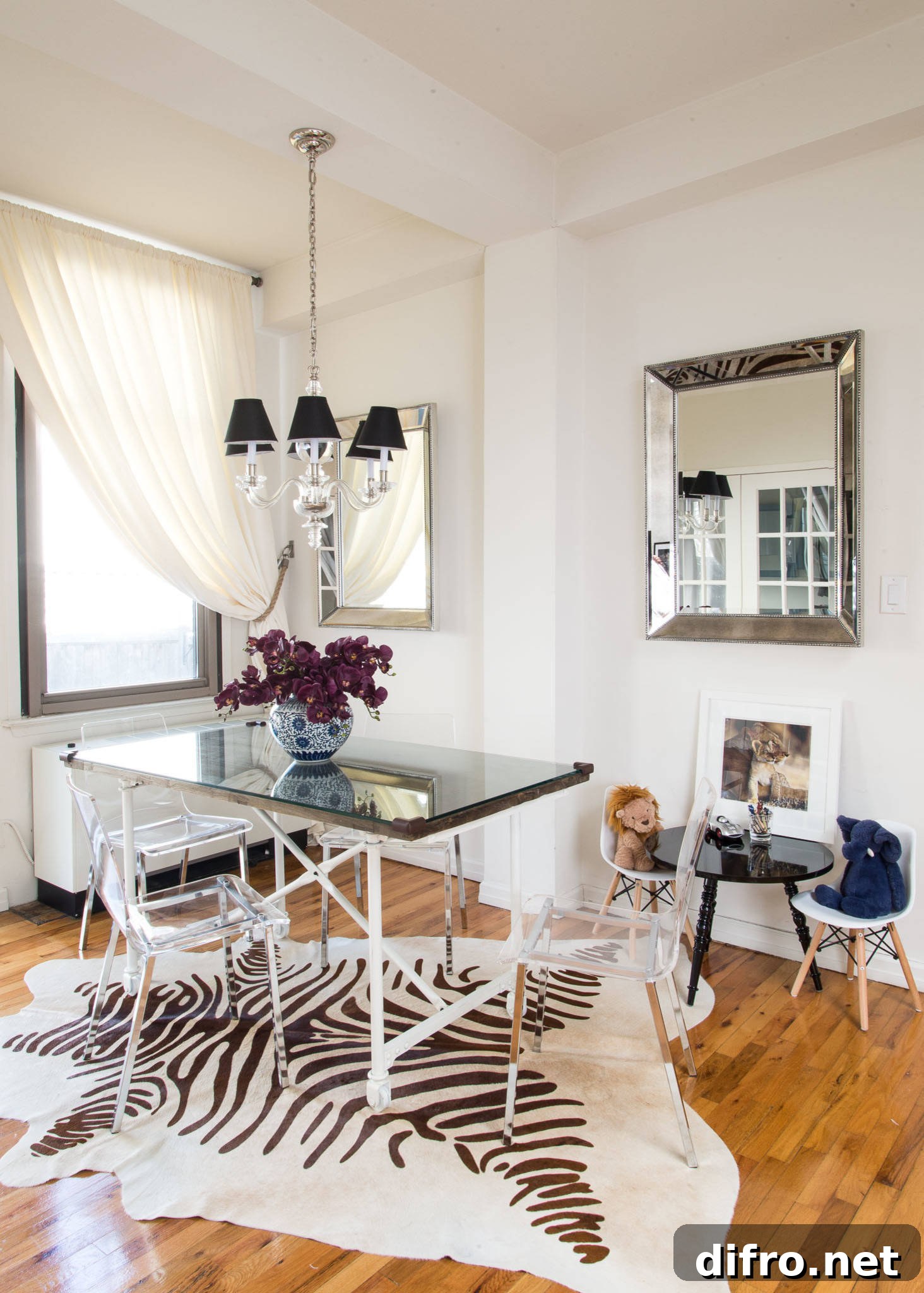 Acrylic chairs and mirrors in a breezy dining room