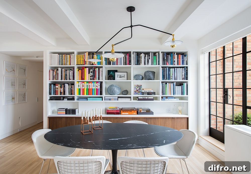 Saarinen dining table with dark marble top in a renovated apartment