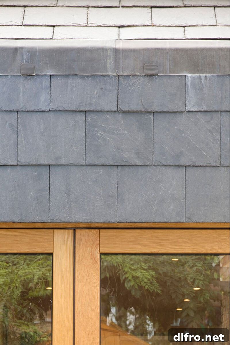 Exterior with gray tiles, wood and glass