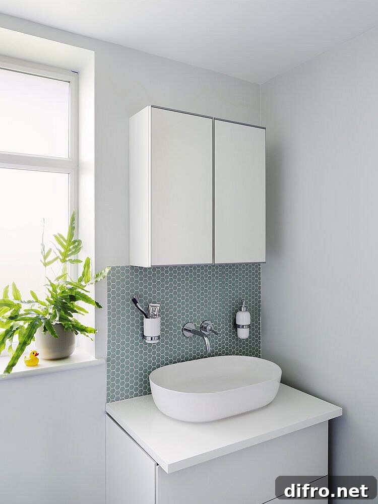 Small vanity in the corner along with medicine cabinet saves space