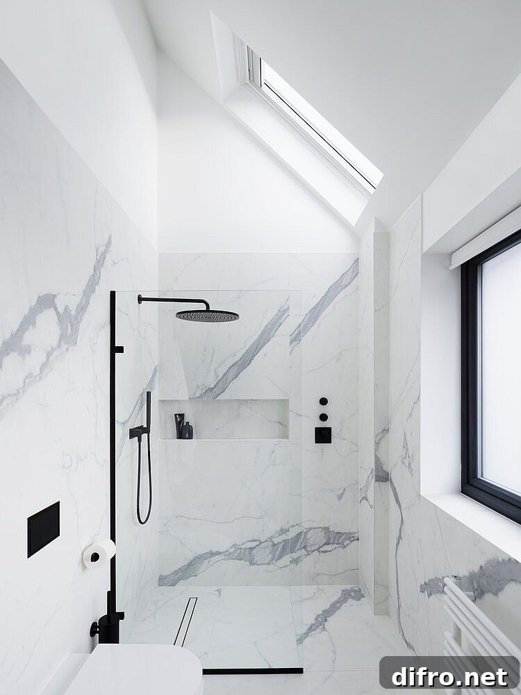 Bianco venato marble brings an air of luxury to the all-white bathroom
