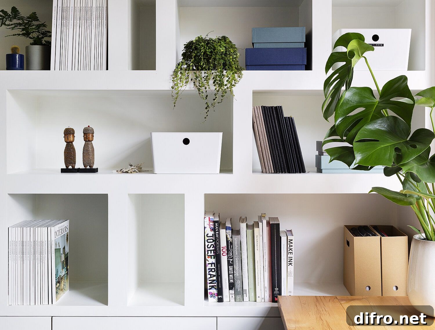 Decorating the modern bookshelf in white with books and more!
