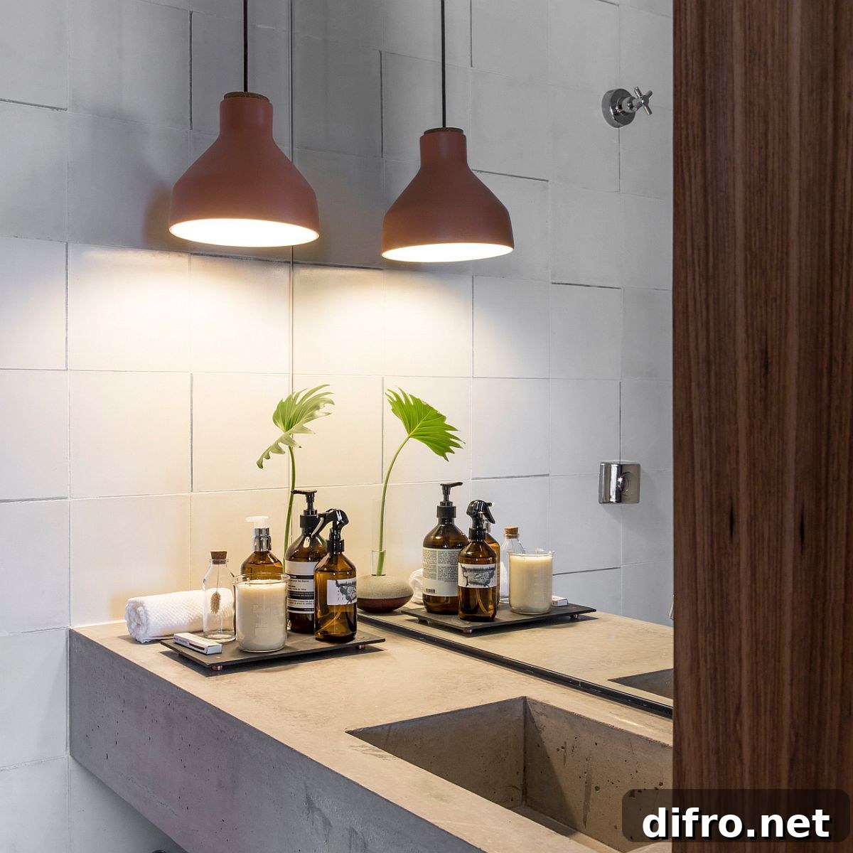 Concrete vanity and pendant light in the industrial-modern bathroom
