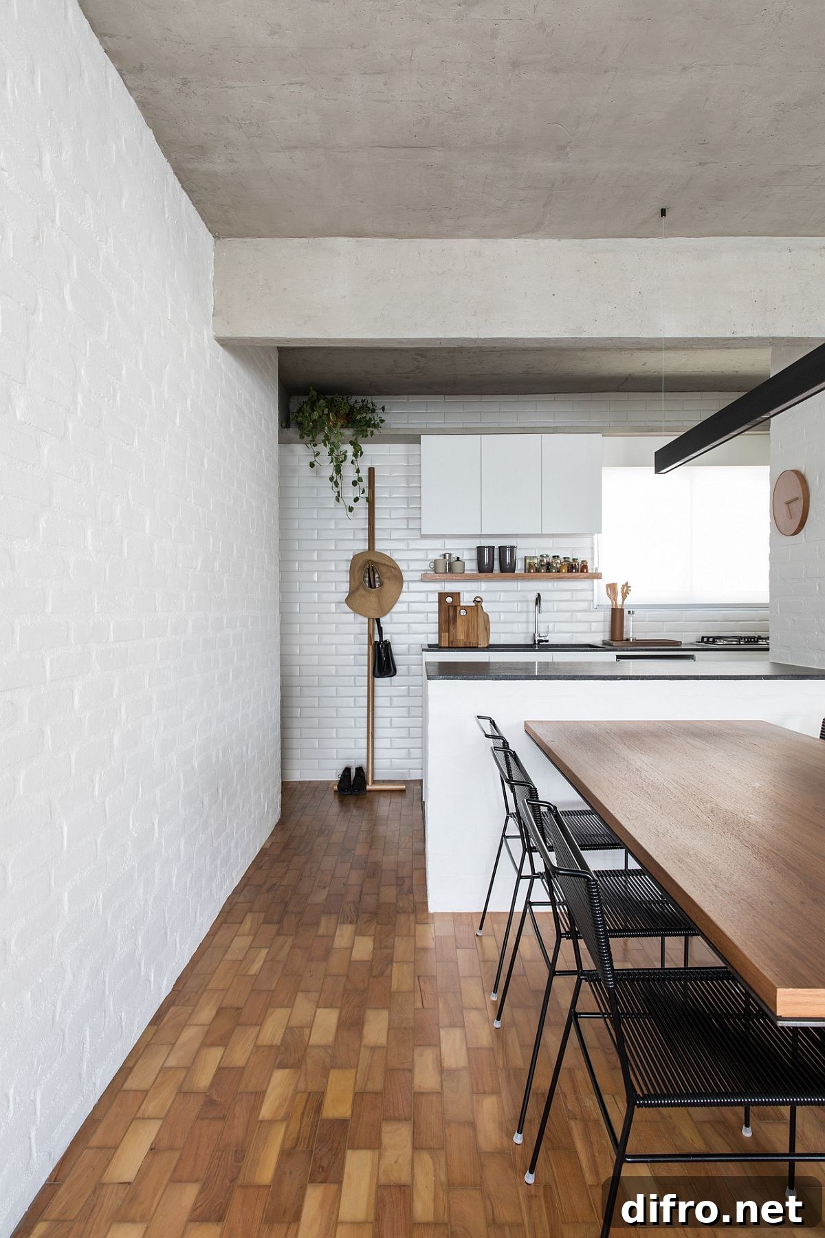 Compact modern kitchen and dining area designed for space efficiency in the VCH Apartment