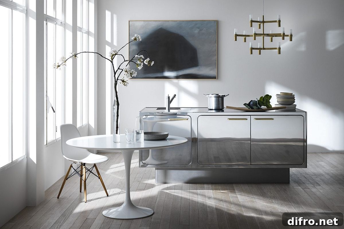 Mirrored steel credenza doubling as a compact kitchen island