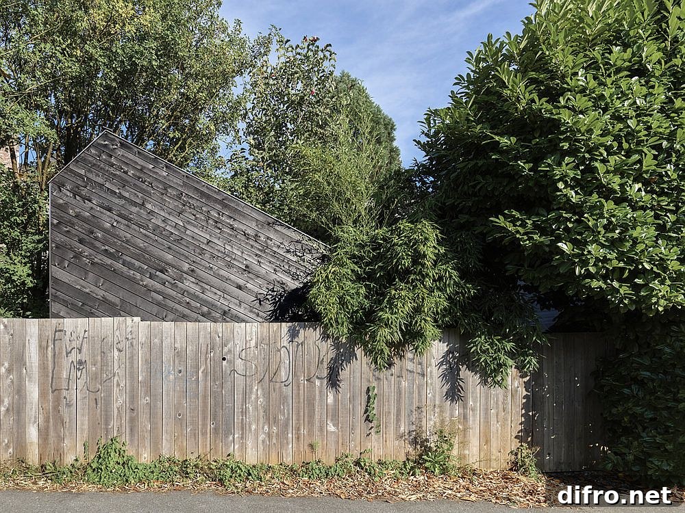 Street view of the compact, timber-clad music shed