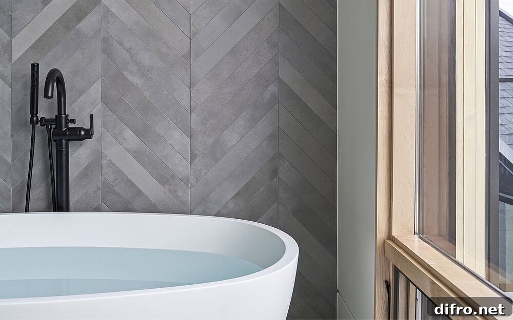 Bathroom with chevron-pattern gray tiles