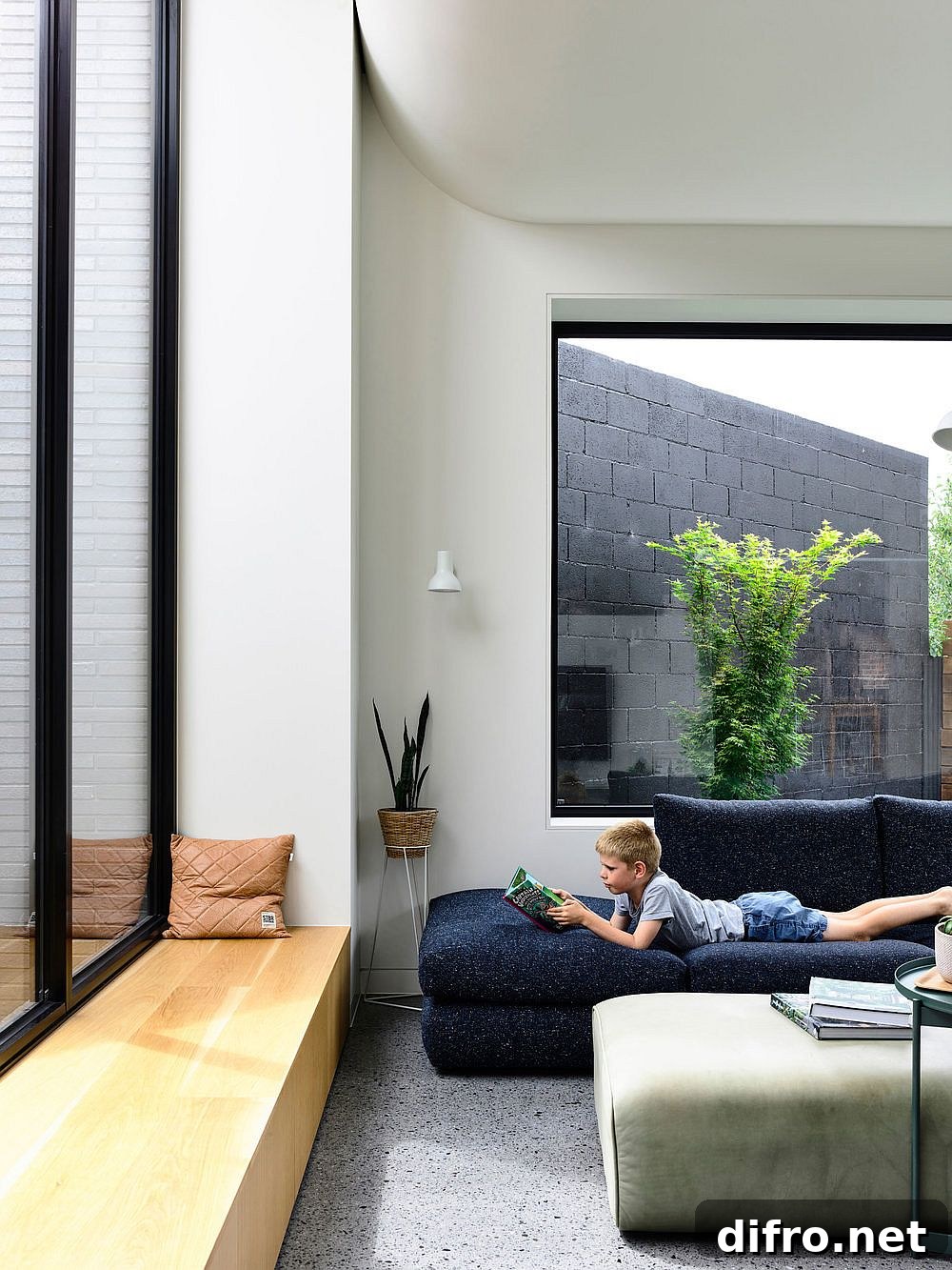 Window seats and large windows connect the interior with the outdoors