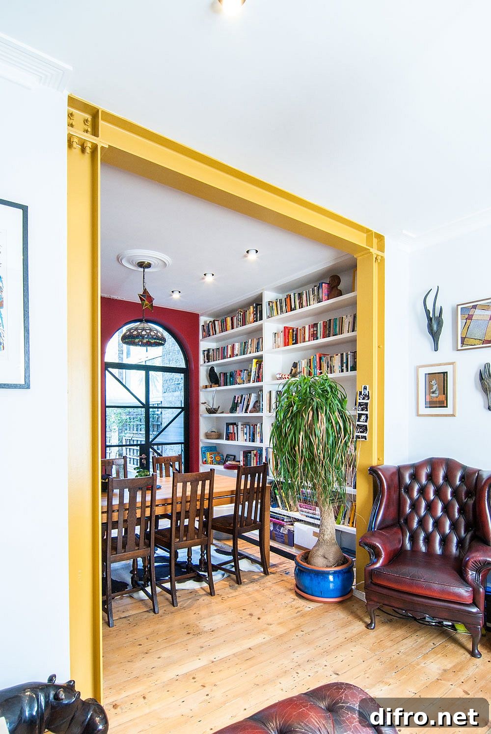 Mustard yellow steel frame connecting spaces