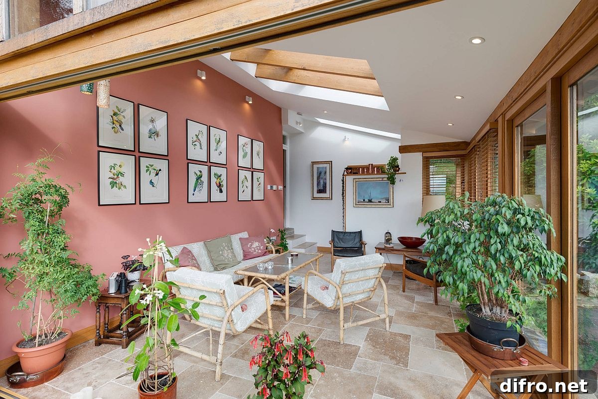Modern sunroom decorated with indoor plants and botanical accents