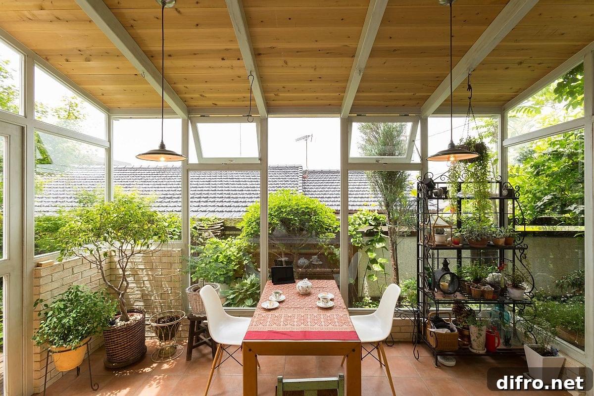 Spacious farmhouse-style sunroom filled with lush greenery