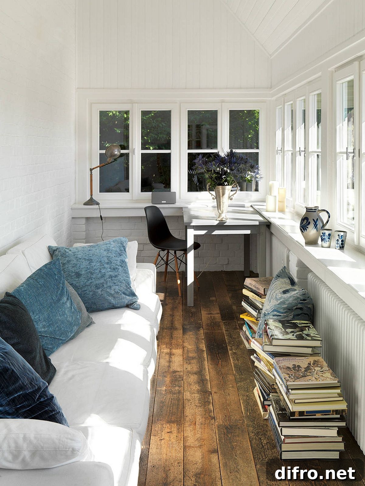 Modern farmhouse sunroom set up as a relaxing workspace