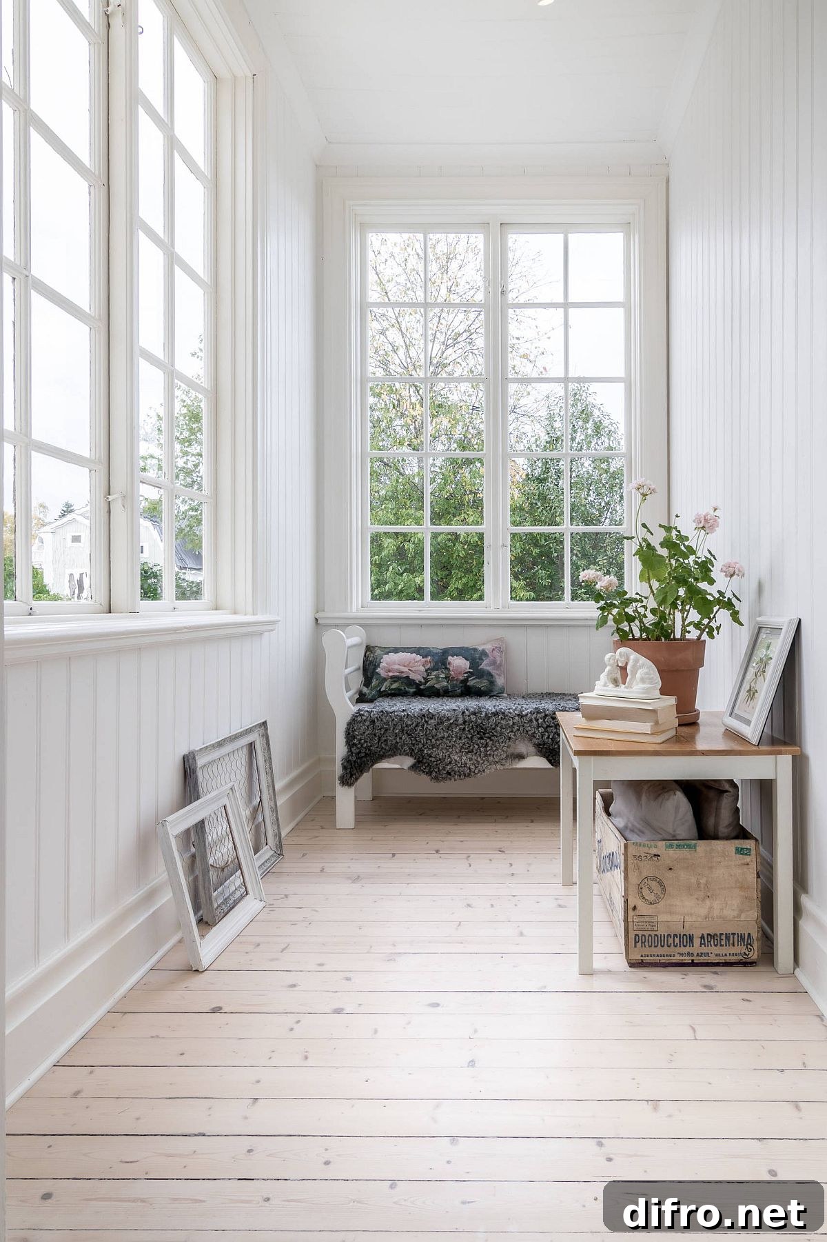 Modest white sunroom with a bright, simple interior