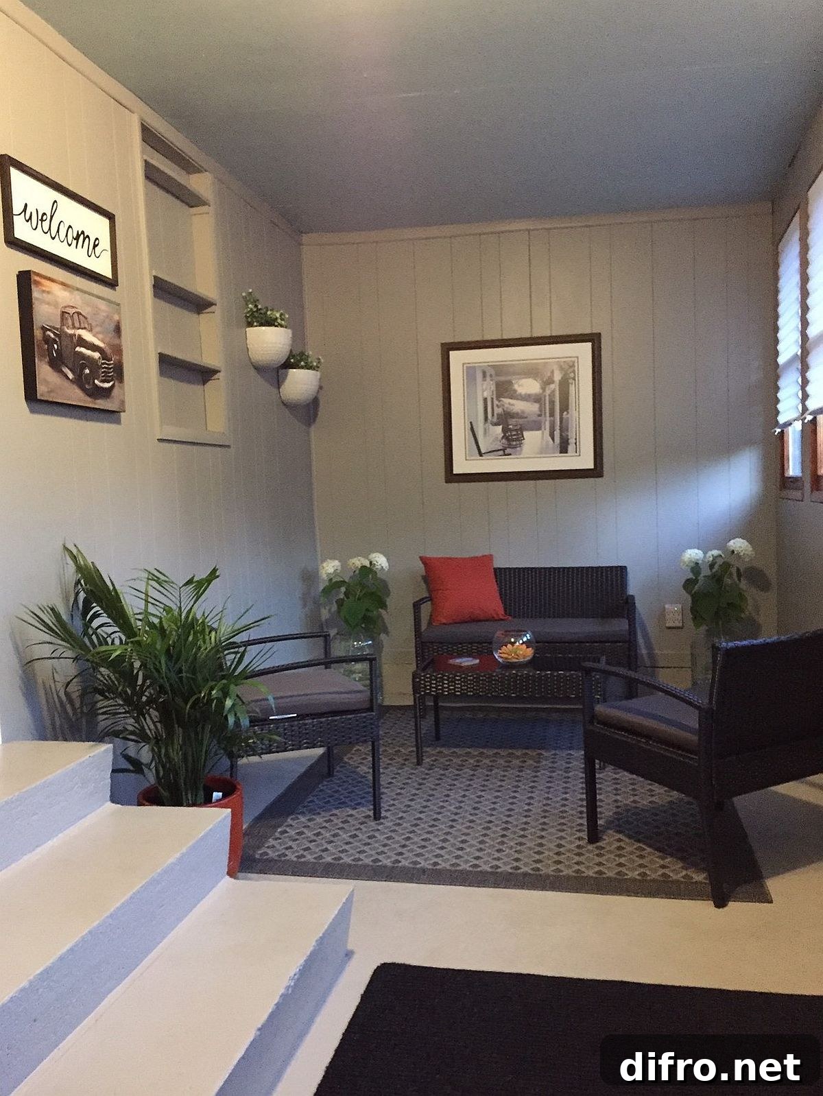 Small sunroom blending farmhouse and modern styles with a restrained palette