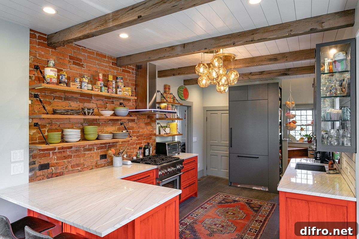 Farmhouse kitchen with exposed brick and brick-red cabinets