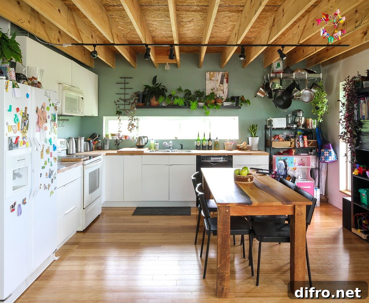 Matte green walls with greenery in farmhouse kitchen