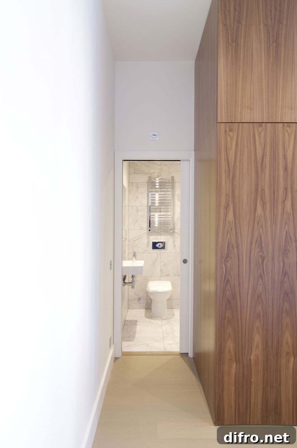 Compact bathroom with glass shower in a small apartment unit