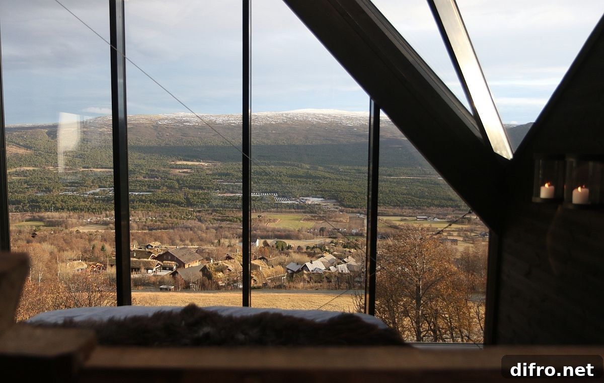Floor-to-ceiling windows bring spectacular mountain views into the cabin