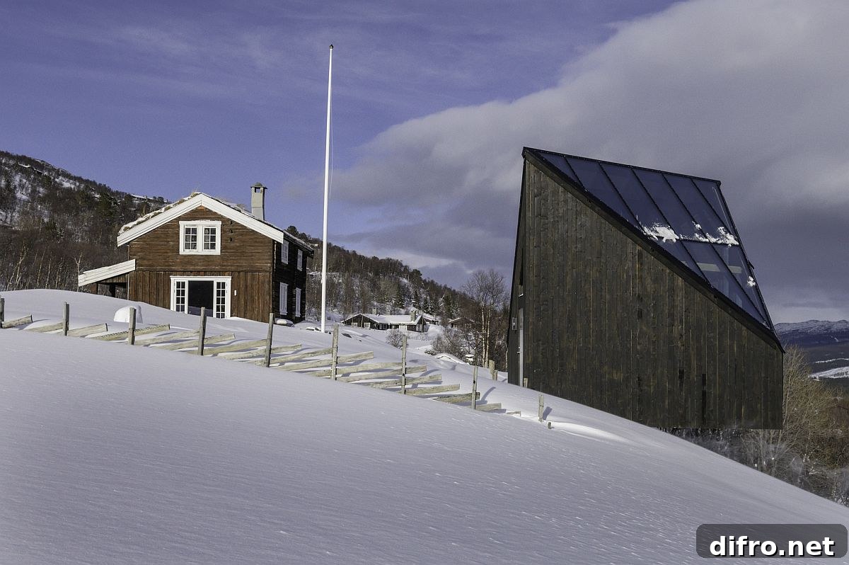 Snow-covered landscape and classic mountain homes provide the backdrop for Diamanten Cabin