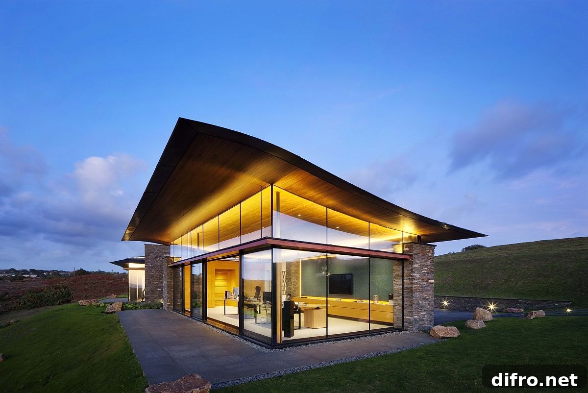 Curvy green roof and floor-to-ceiling glass windows