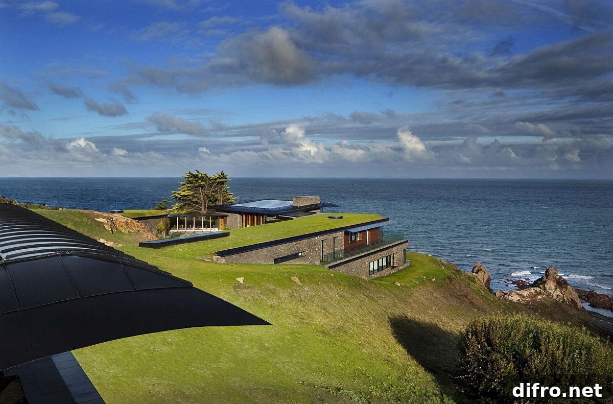 Green roof blends the home into the coastal landscape