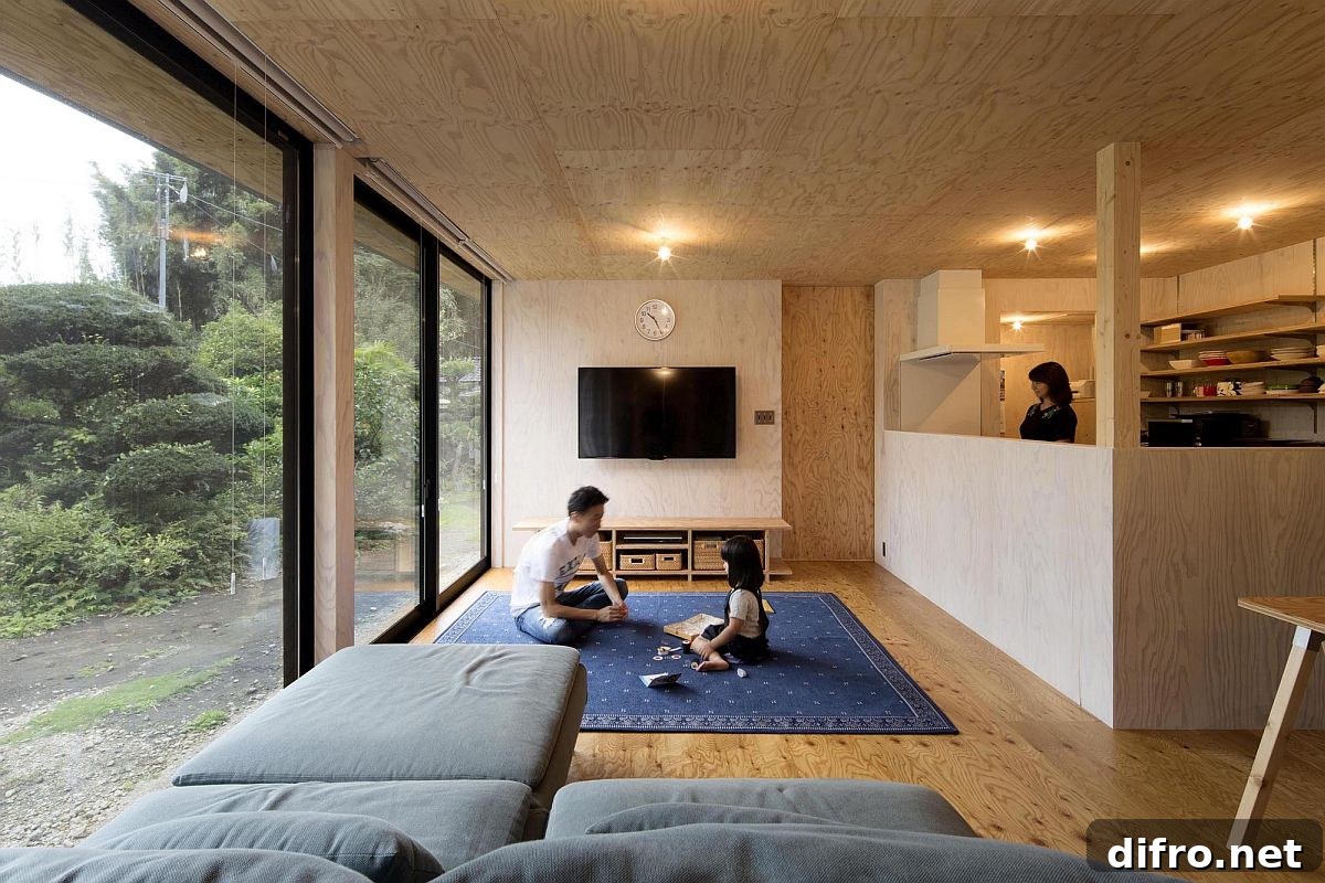 Wood-clad living area and kitchen with sliding doors