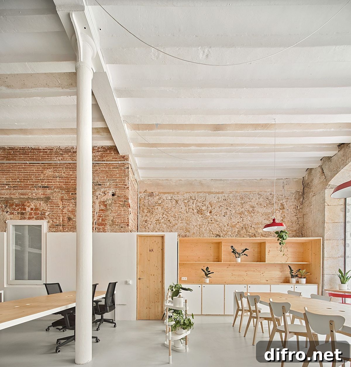Custom cabinets in wood, greenery and exposed brick wall