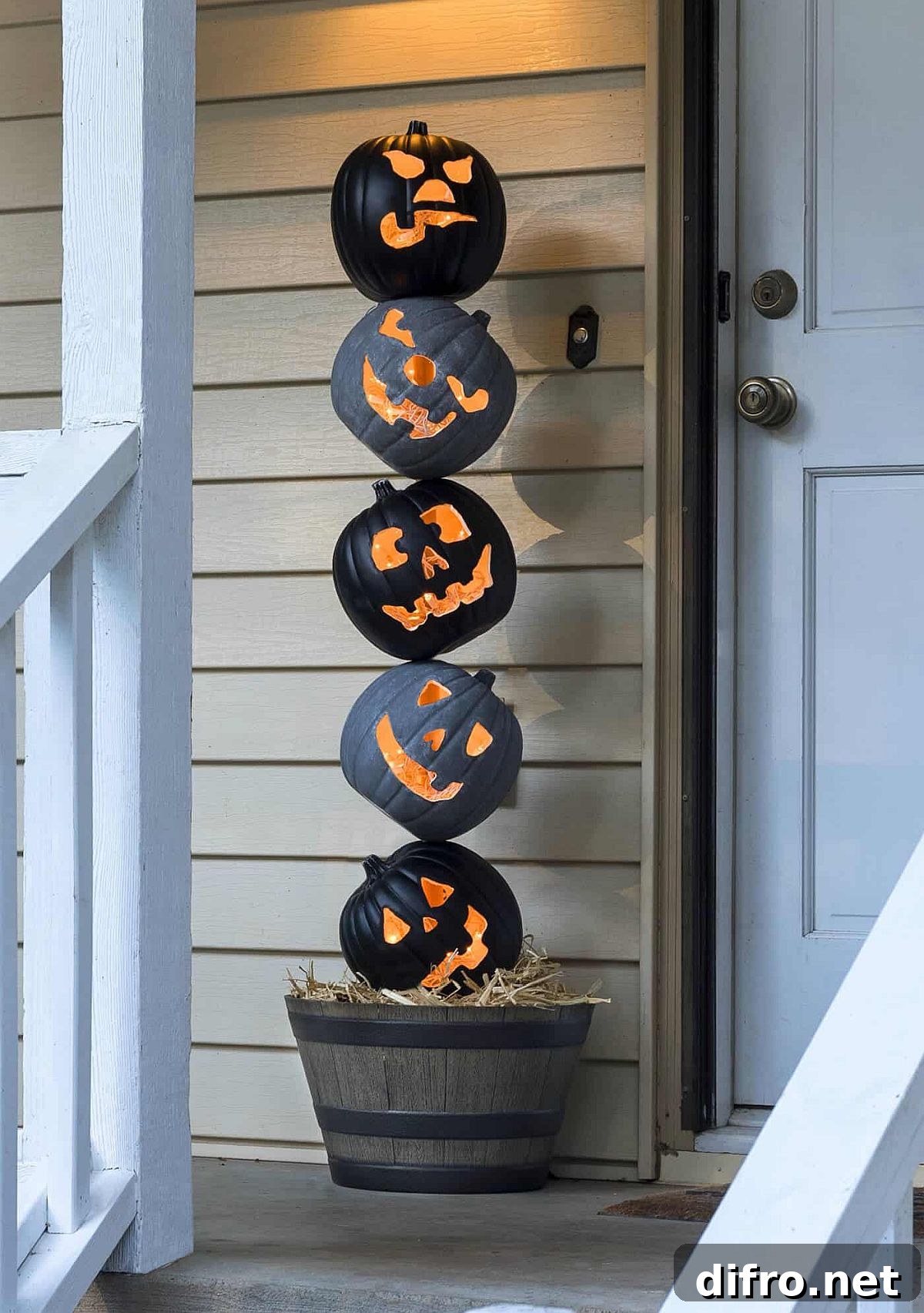 Lighted pumpkin topiary on front porch