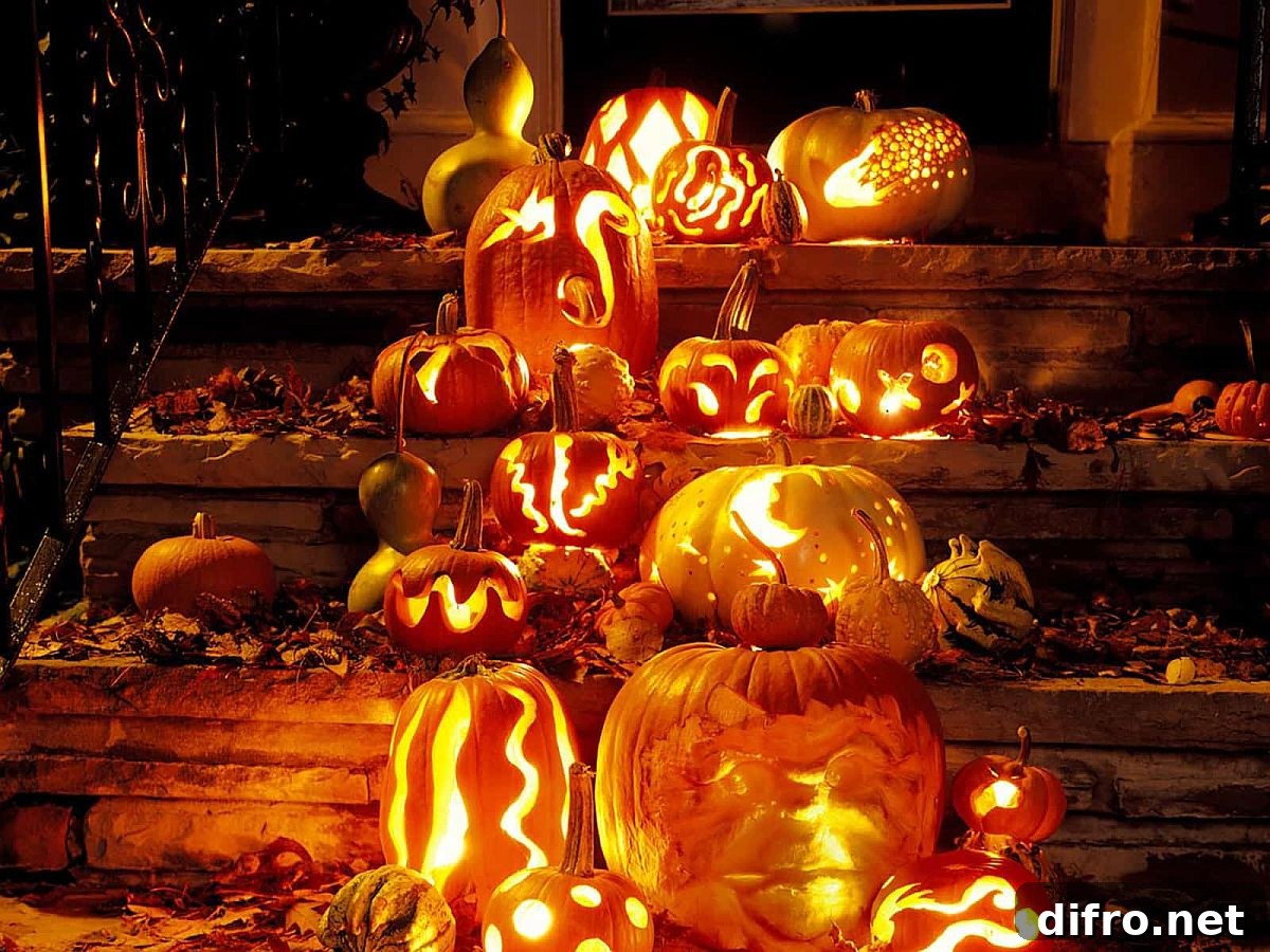 Carved pumpkins and fall leaves on porch