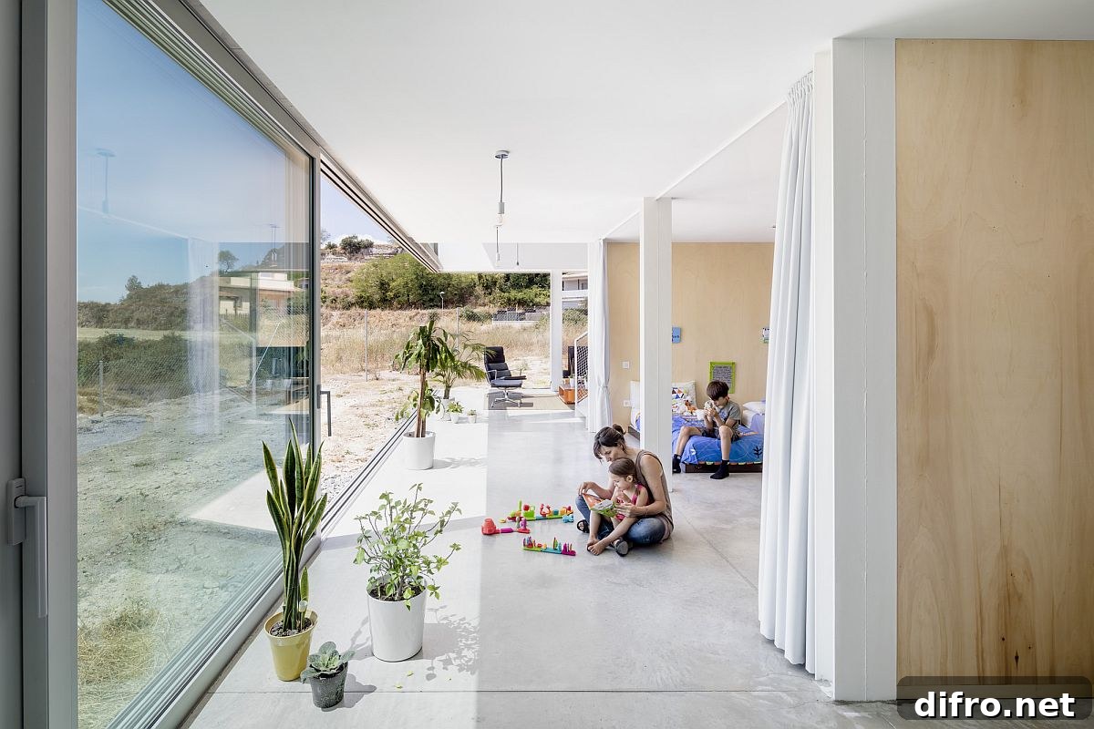 Sliding glass doors connect the lower level living areas and bedroom with the outdoors