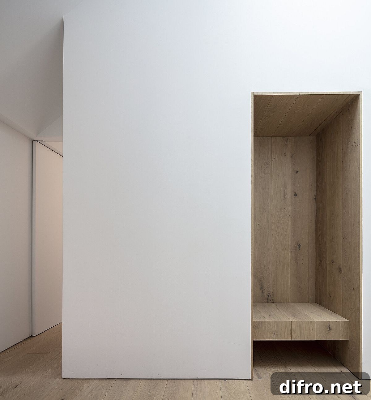 Minimal white and wood interior of the Ledge House
