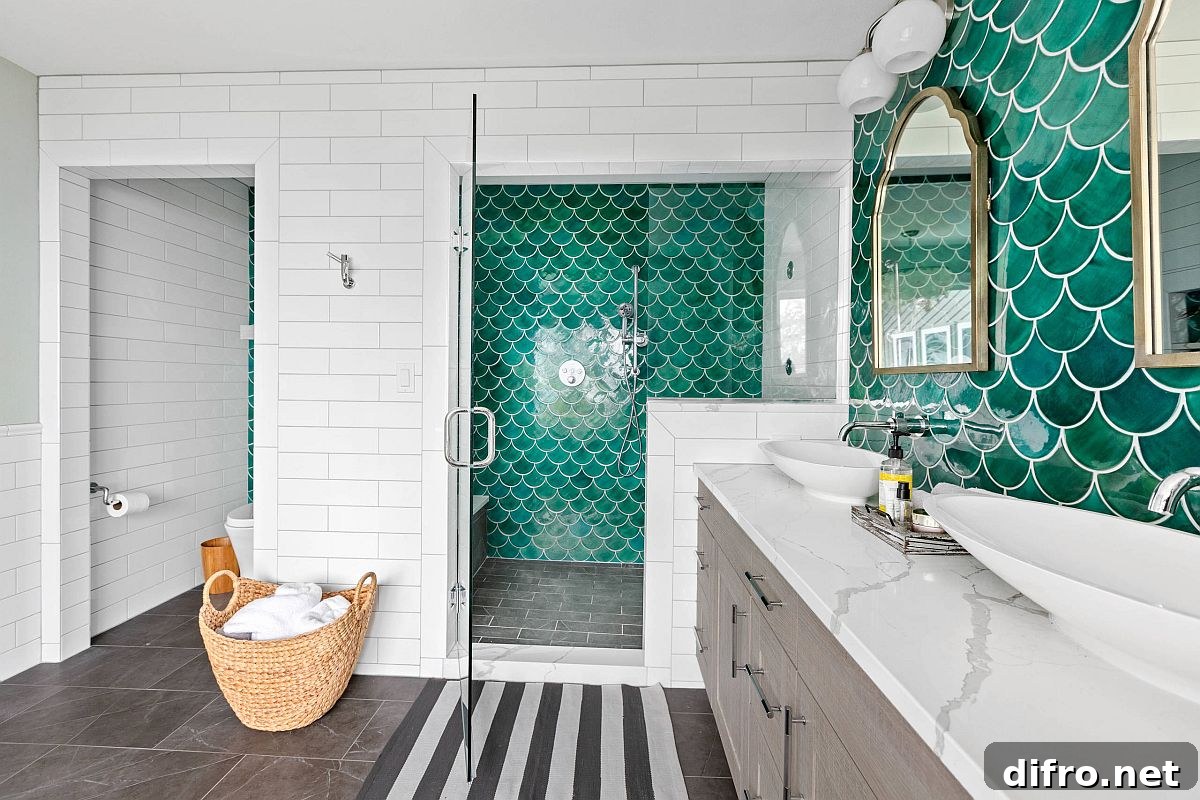 Green tile accent wall in a beach-style bathroom